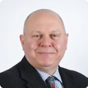 A person in a suitDescription automatically generated